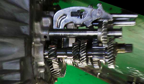 Dismantled Gearbox a dismantled gearbox on a metal bench showing the gearbox casing, shafts, gears and selectors all in situ for reference against our animation