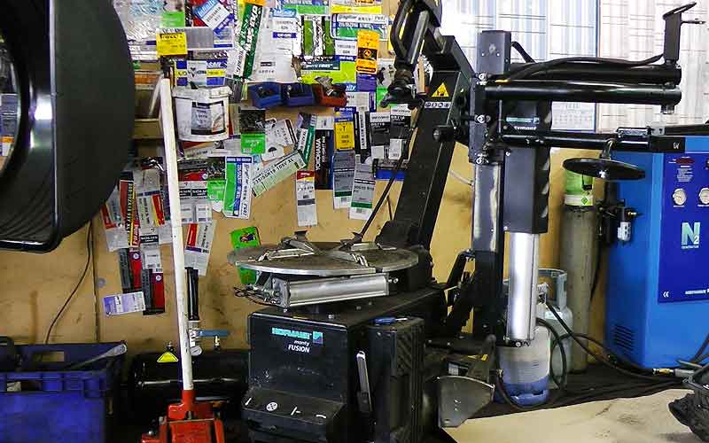 distance corner view of our tyre fitting bay with tyre equipment all ready to work